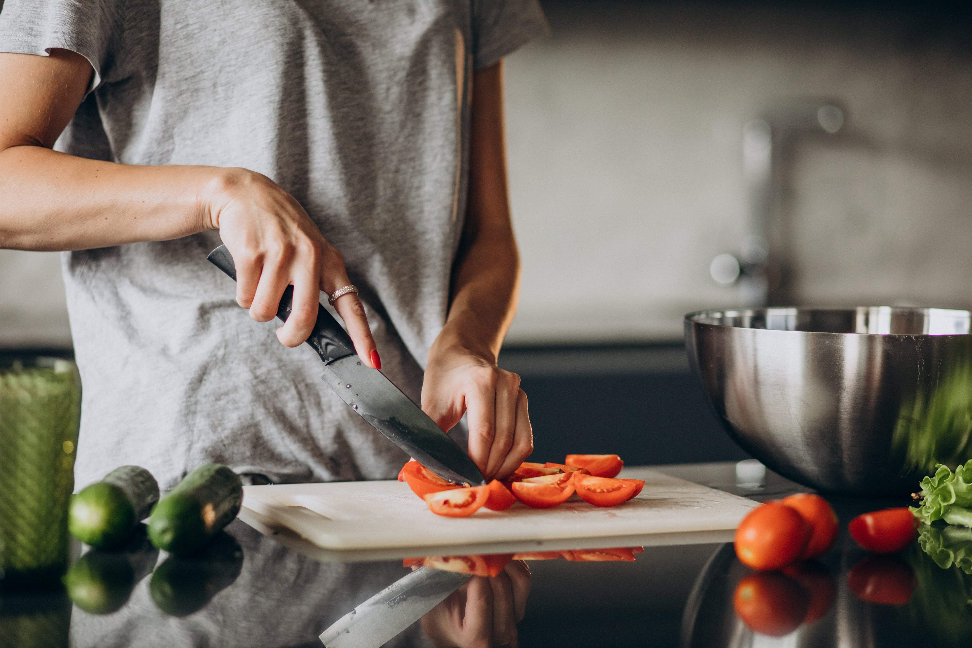 professional chef cutting vegetables preparing food